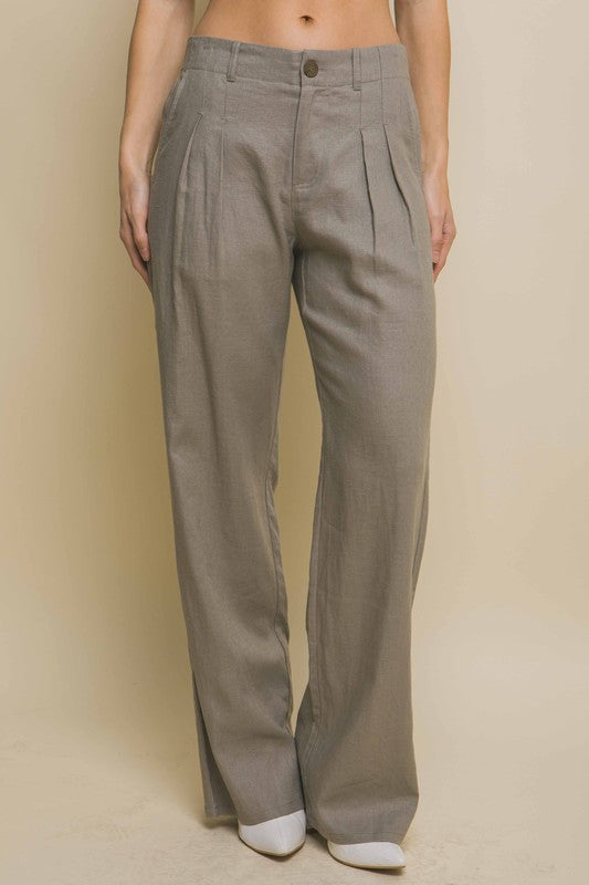 model is wearing Greystone Linen Tailored Wide Leg Pants with white heels
