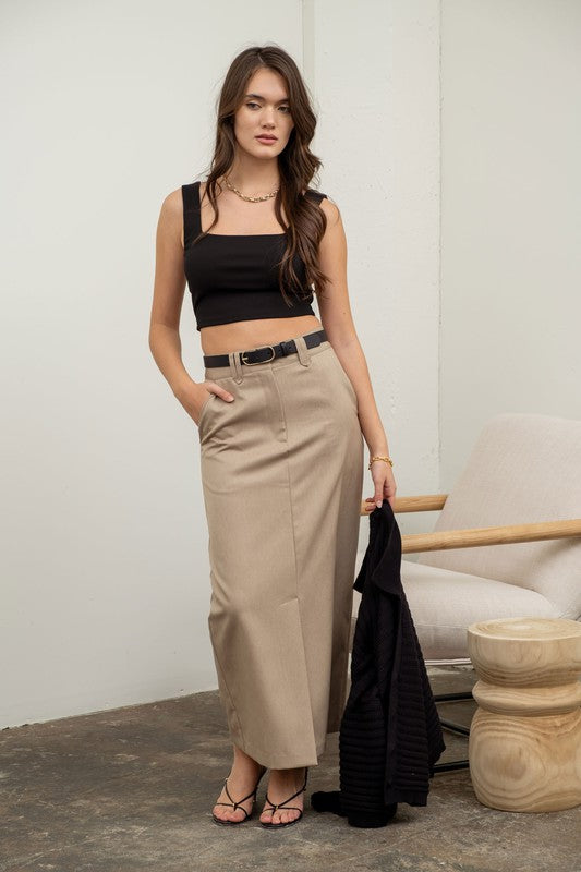 model is wearing Black Solid Square Neck Tank with beige maxi skirt and black lace up sandals 