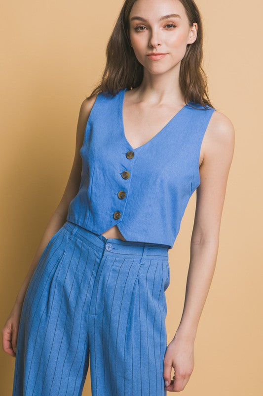 model is wearing Blue Linen Buttoned Vest Top with matching pants