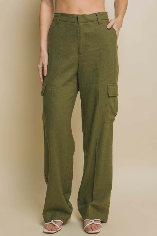 model is wearing Olive Linen Cargo Pants with white heels