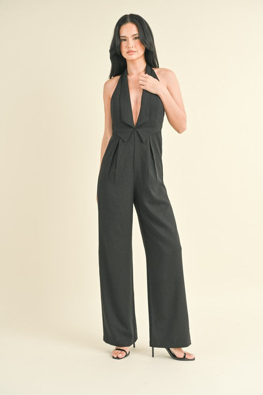 model is wearing Black Tailored Vest Jumpsuit and heels 