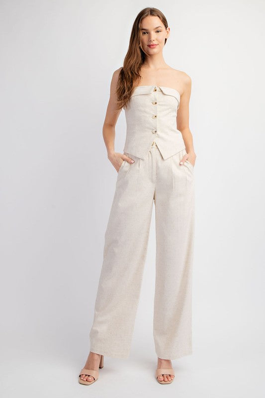 model is wearing Oatmeal Linen Down Tube Top with matching pants and beige heel sandals 