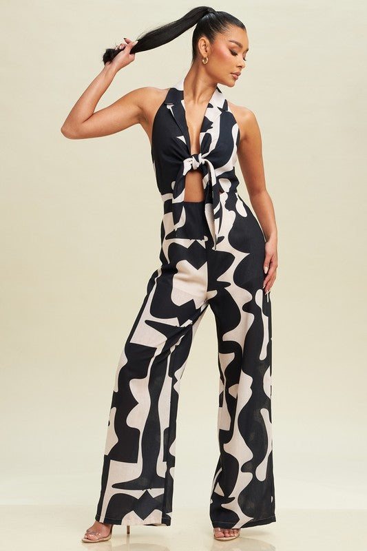 model is wearing Taupe Black Linen Abstract Jumpsuit  with heels 