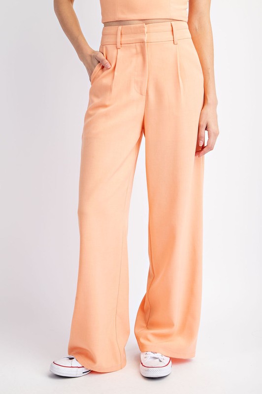 model is wearing Peach Double Waist Trousers  with white sneakers 