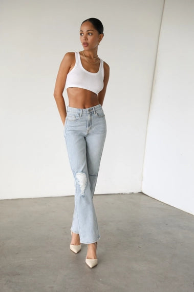 STYLED BY ALX COUTURE MIAMI BOUTIQUE Light High Rise Straight Denim Jeans with ripped leg detail