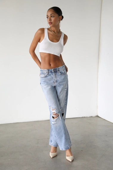 STYLED BY ALX COUTURE MIAMI BOUTIQUE Light denim straight jeans with ripped knees detail