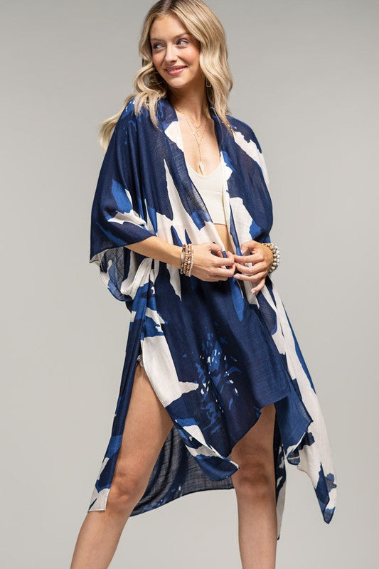model is wearing Navy Sweeping Floral Kimono with a white top 