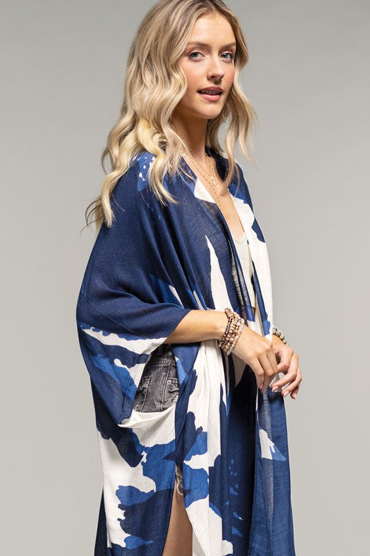 model wearing Navy Sweeping Floral Kimono with a white top and washed denim shorts