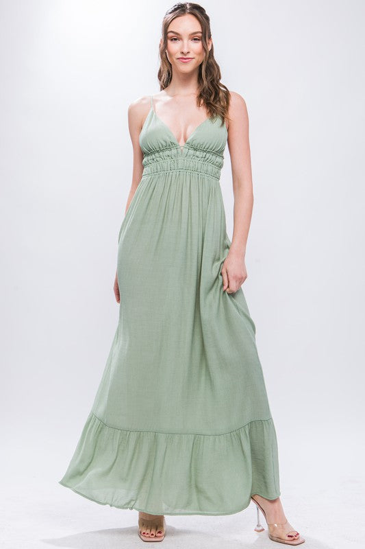 model is wearing Moss V-Neck Maxi Dress with high heels