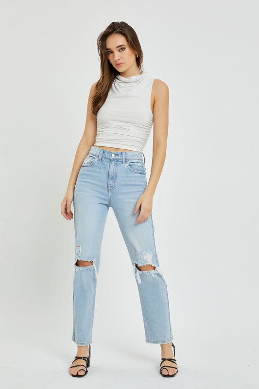 model is wearing a natural top with Light Denim High Rise Straight Jean and black sandals 