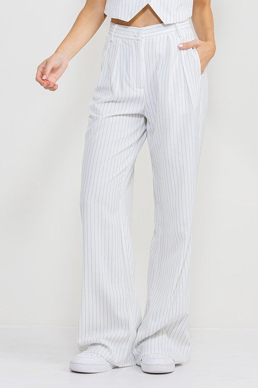 model is wearing White Stripe Long Pants and white sneakers 