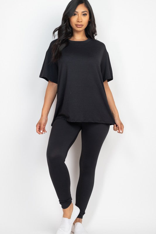 model is wearing Black Oversized Top & Leggings Set and white shoes