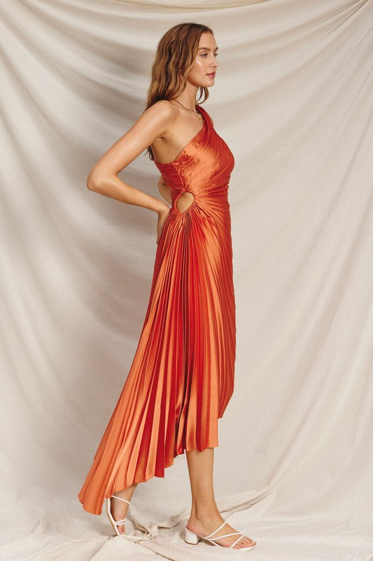 side view of the Mimosa Ochre Olympia Asymmetrical Pleated Maxi Dress and white sandals