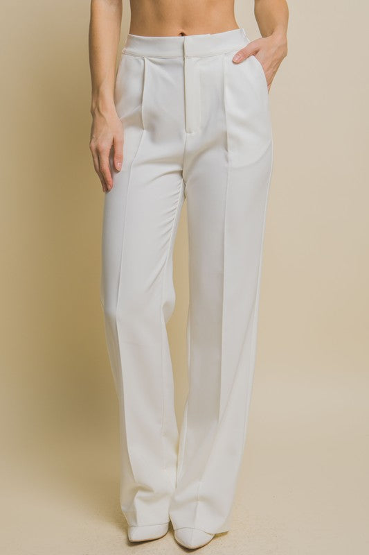 model is wearing White Regular-Fit Dress Pants with white heels 