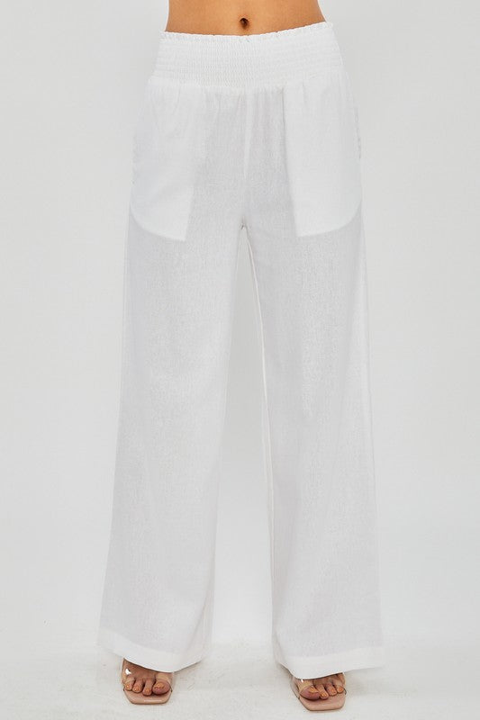 model is wearing White Linen Pants with Smocked Waist