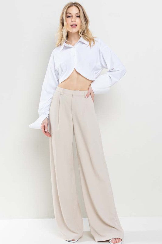 model is wearing white shirt and Nude Wide Leg Pants with sandals