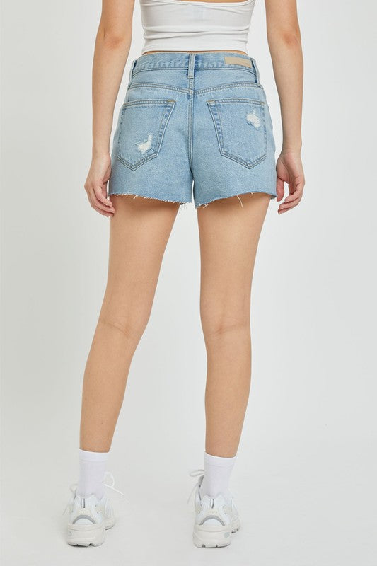 back of the model wearing the outfit with Light Denim High Rise Mom Shorts