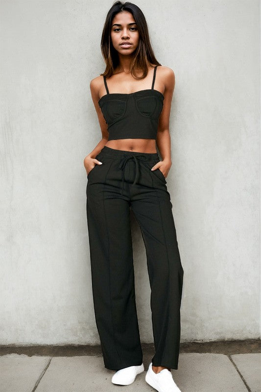 model is wearing Black Cami Top Straight Pants Set with white sneakers
