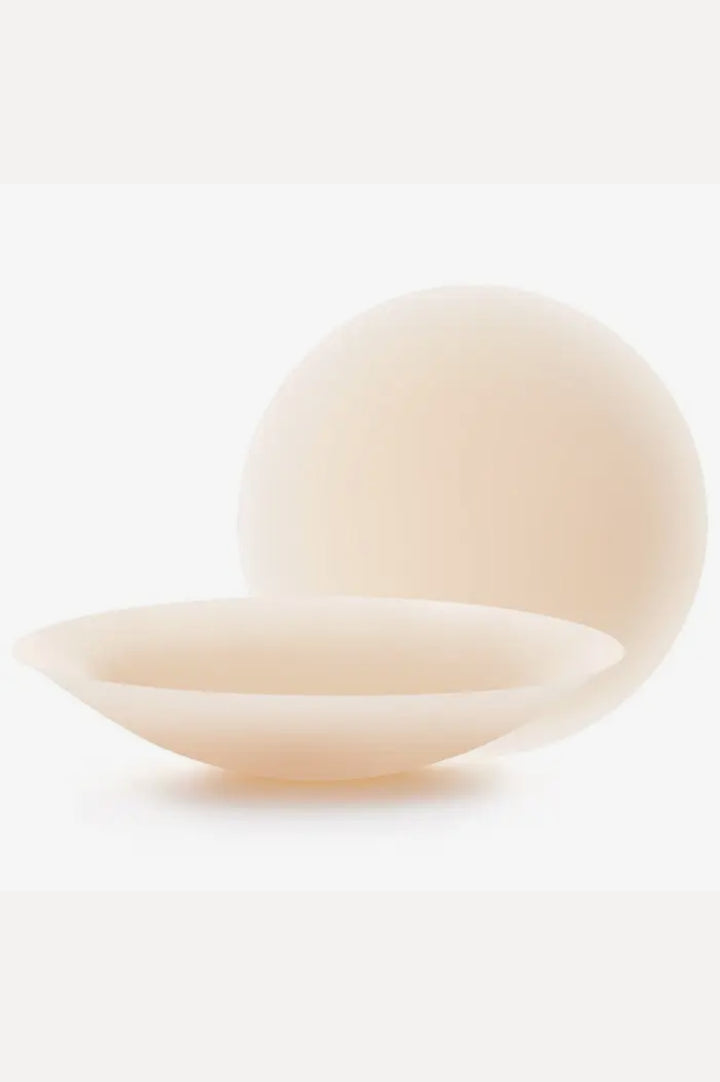 Two beige ceramic bowls on a white background