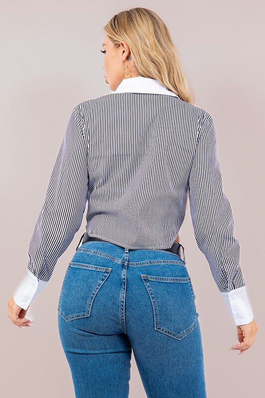 back view of the Black Striped Constrasted Blouse  and denim pants