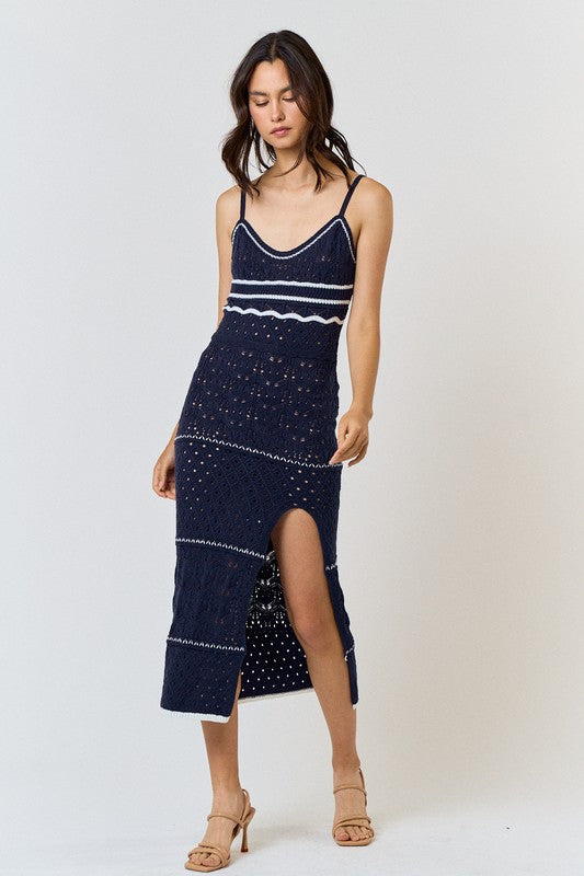model is wearing Navy Crochet Striped Maxi Dress with beige heels 