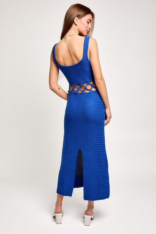 back of the model wearing Blue Crochet Sleeveless Midi Dress with white heels 