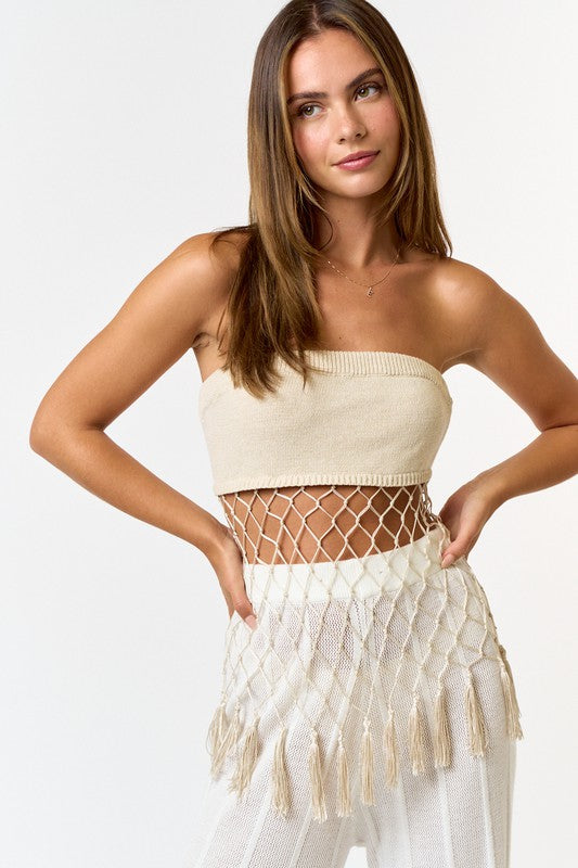 Model is wearing Natural Crochet Tassel Tube Top with white mesh pants 