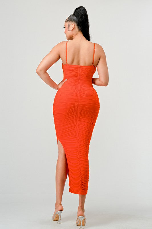 STYLED BY ALX COUTURE MIAMI BOUTIQUE Model is wearing Orange Lux Ruched Mesh Layer Side Open Slitted Midi Dress back view 