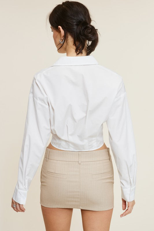 Back view of the White Giselle Shirt and the beige mini skirt