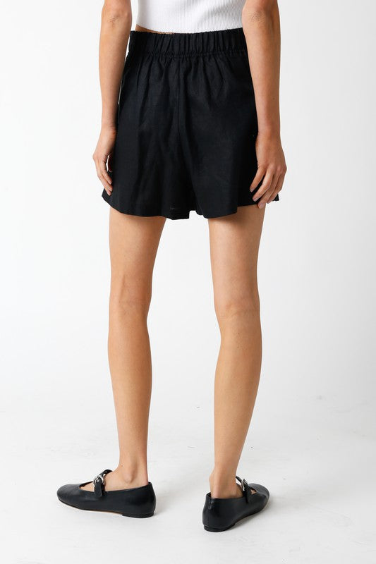 STYLED BY ALX COUTURE MIAMI BOUTIQUE Model is wearin Black Jolie Shorts with ballerina flats back view