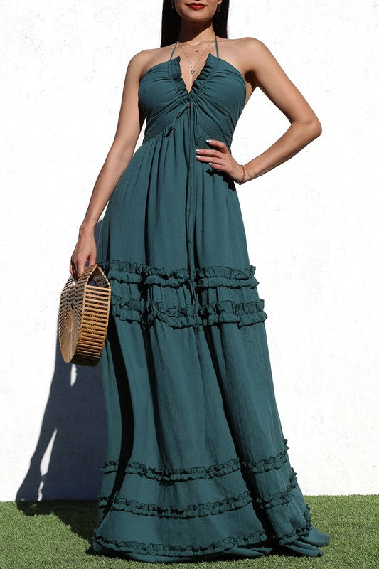 model is wearing Teal Green V Neck Maxi Dress with a wooden basket handbag 