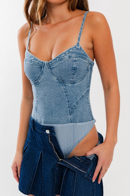 STYLED BY ALX COUTURE MIAMI BOUTIQUE Model is wearing Denim Bustier. Detail of the bodysuit 