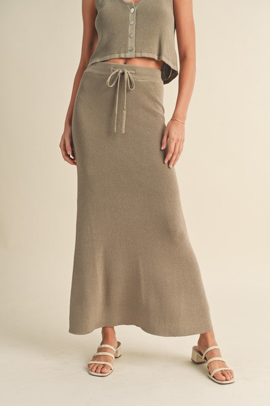 model is wearing Green Grey Knitted Maxi Skirt and white heels 