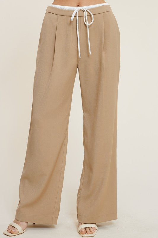 model wearing Sand Desire Trousers with white heel sandals