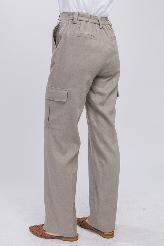 model is wearing Greystone Linen Cargo Pants and camel mules 