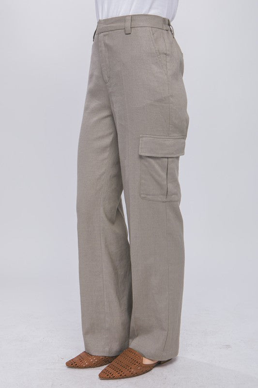 model is wearing Greystone Linen Cargo Pants and camel mules 