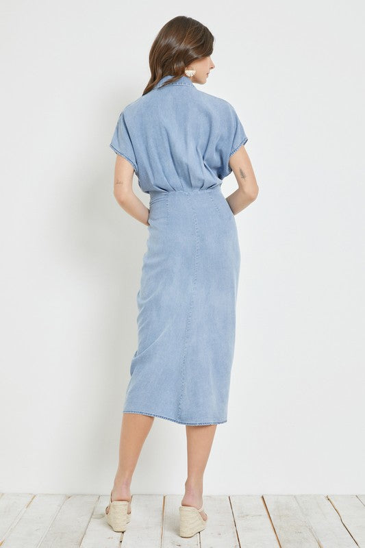 model is wearing Washed Denim Ruched Waist Tied Dress and wedges sandals, back view 