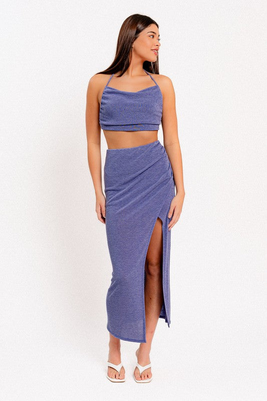 STYLED BY ALX COUTURE MIAMI BOUTIQUE Model is wearing Blue Surplice Maxi Skirt with white heels and matching blue top 