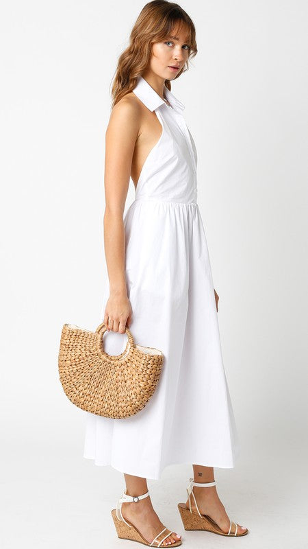 side of the White Sophie Dress with a straw handbag and white wedges sandals