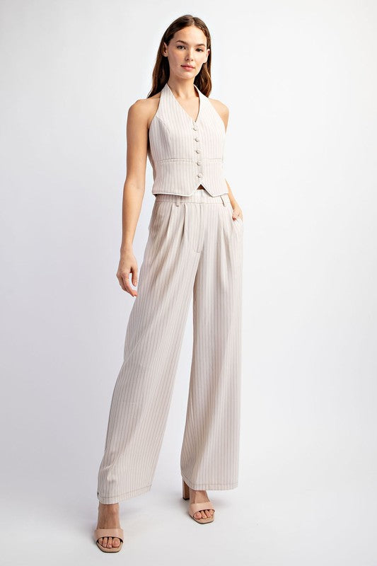 model is wearing Beige White Tailored Halter Vest with matching pants and beige heel sandals