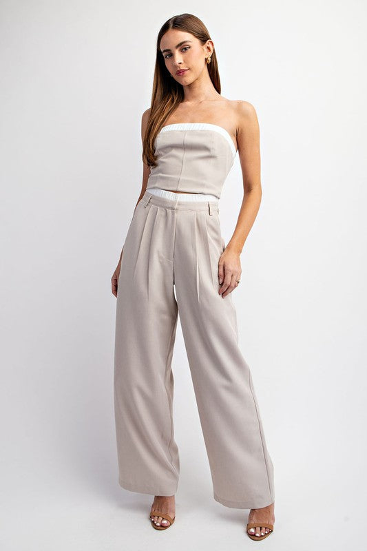 model is wearing Taupe Tailored Elastic Waist Pants with matching tube top and beige heel sandals 