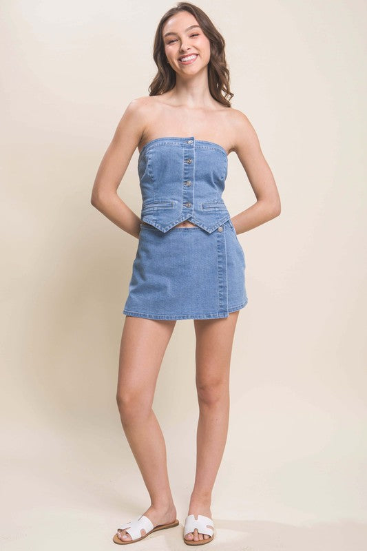 model wearing Light Denim Snap-On Button Skorts with matching vest and white slide sandals
