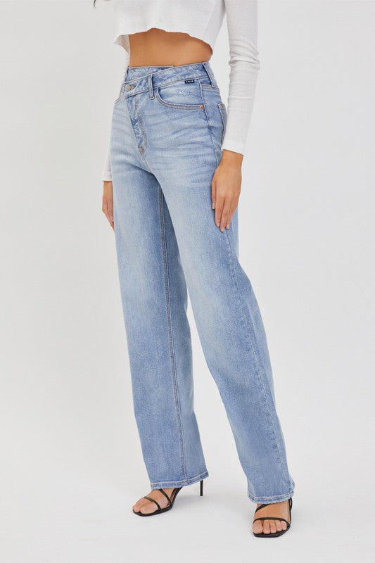 model is wearing Denim Re-positioned Closure Dad Jean with black sandals 
