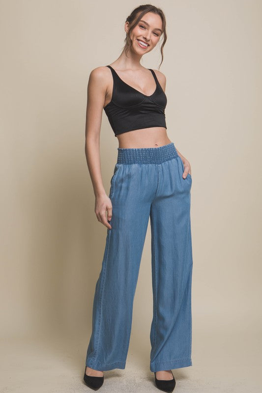 model is wearing Blue Casual Elastic Waistband Pants and black crop top with black heels