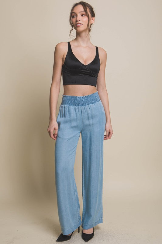 model is wearing Light Blue Casual Elastic Waistband Pants with black top and black top 