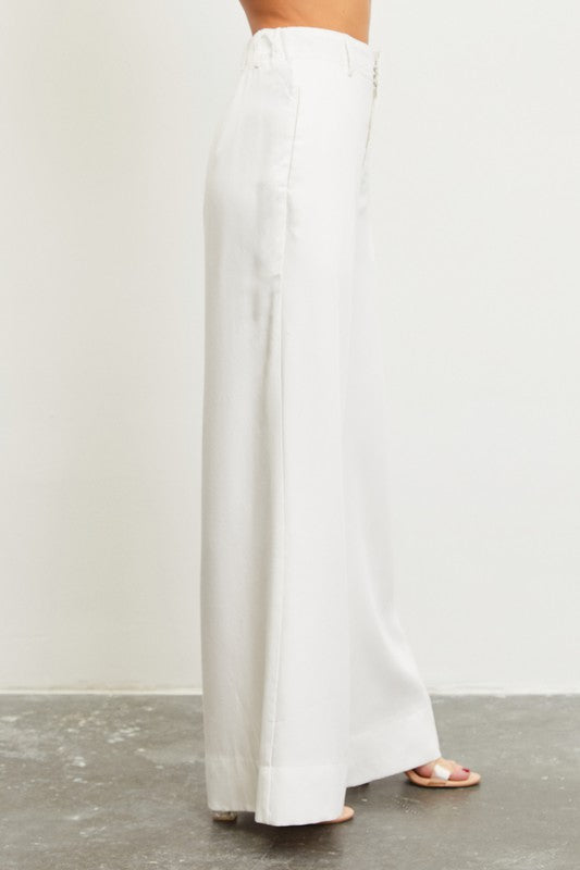 model is wearing White High Waist Elastic Back Pants with heels, side view of the pants 