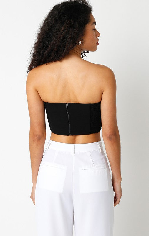back of the Black Rosie Top and white trousers