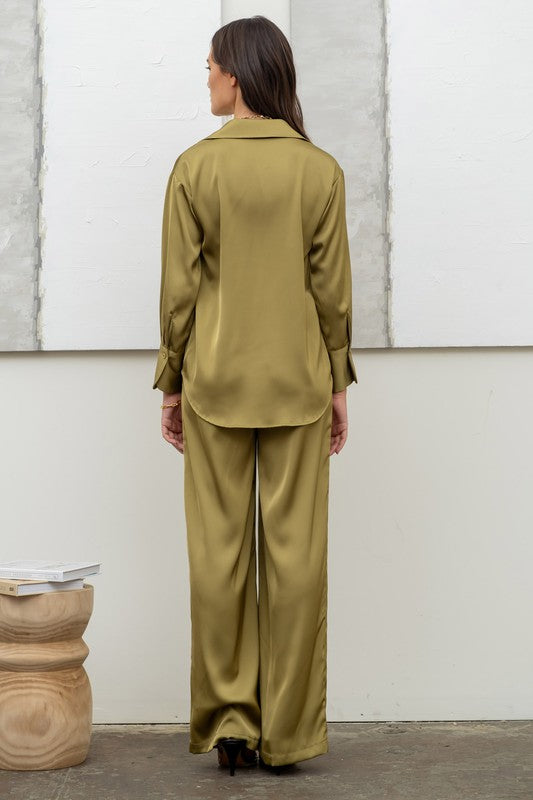 back of the model wearing Light Olive Satin Button Up Top with matching pants
