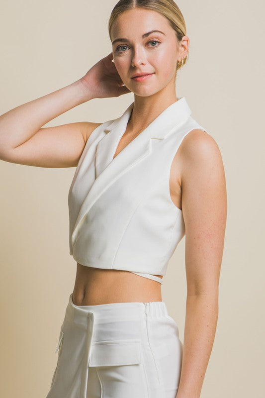 model is wearing White Vertigo Crop Blazer Vest  with matching bottom