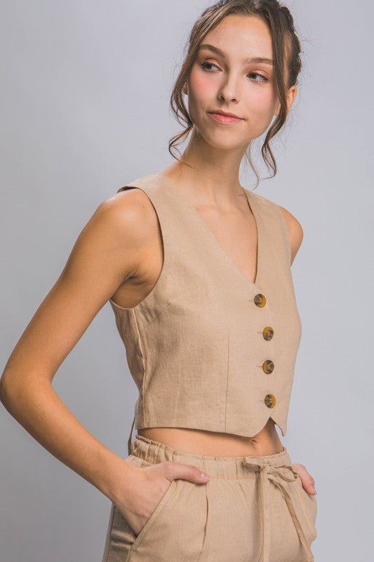 side view of the model wearing Khaki Linen Buttoned Vest Top and matching pants 